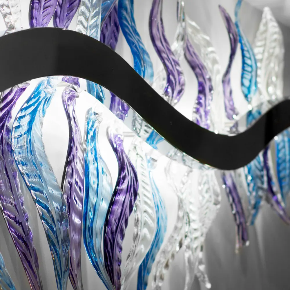 Purple, blue and clear crystal leaves along a wavy black band, Crystal lights